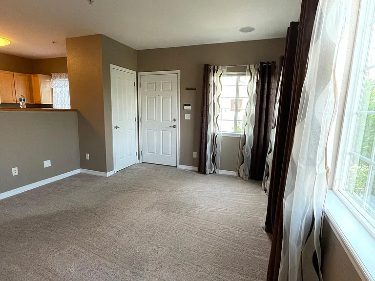 Living room - lots of natural light and coat closet
