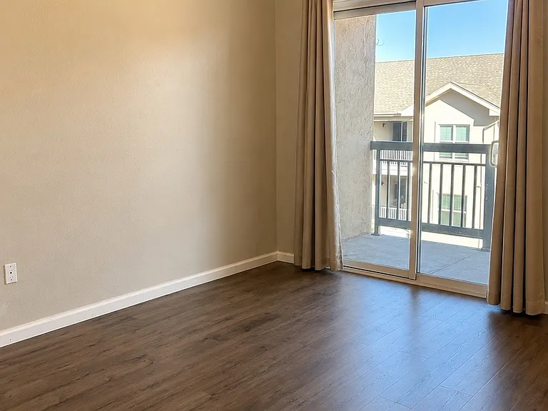Master Bedroom sliding glass door and private balcony.