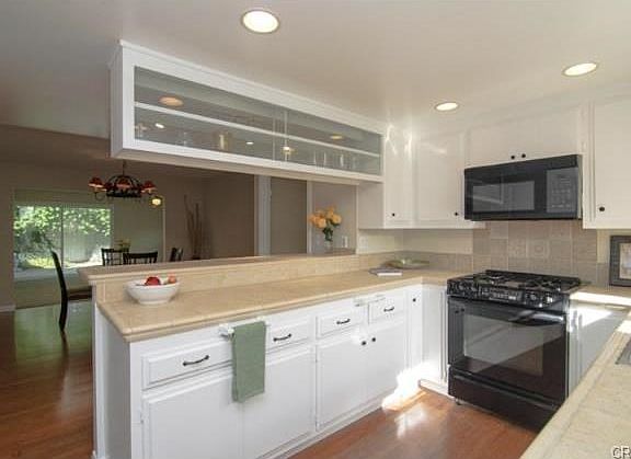 Kitchen gleams with fresh paint on all surfaces including cabine