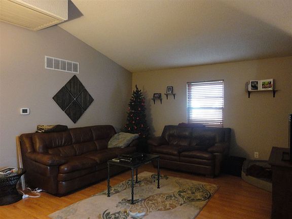 Living room has laminate flooring.