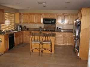 large open kitchen with granite counter tops; island;