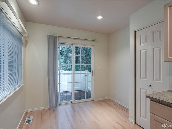 This kitchen is complete with tons of natural light, real hardwood floors and a floor to ceiling pantry.