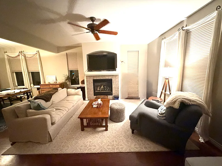 Living room with fireplace and dining room