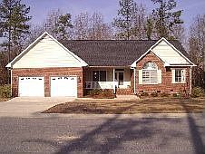 Woods behind, sprinkler system