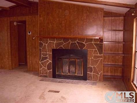 Wood burning fireplace in living room