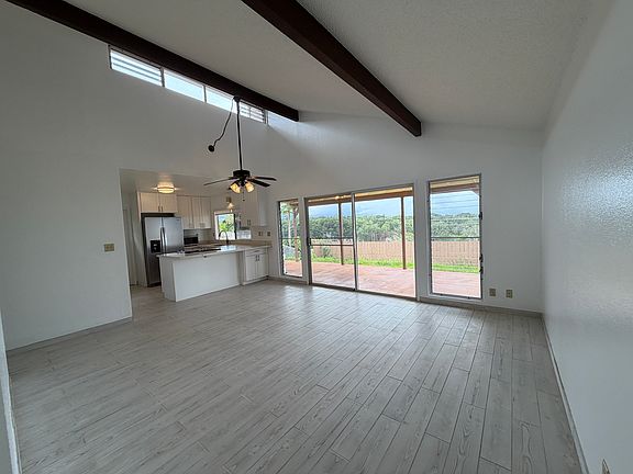 Spacious living room, vaulted ceilings, panoramic views from this perimeter lot