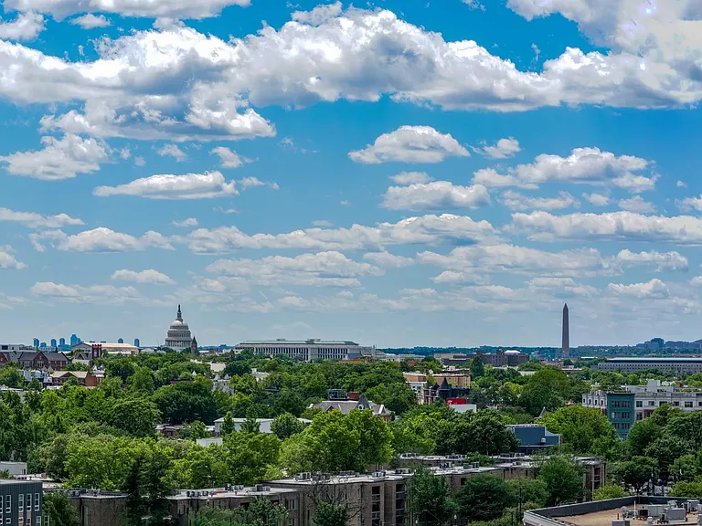 Wide-reaching views from Modera H Street showcase the DC skyline, with landmark silhouettes rising above tree-lined neighborhoods and city streets.