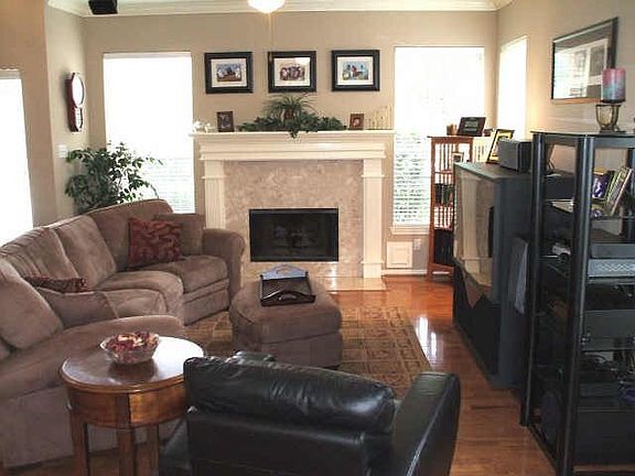 Sizeable Family Room with Wood Floors and Fireplace