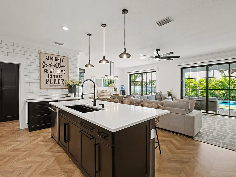Kitchen facing living and dining