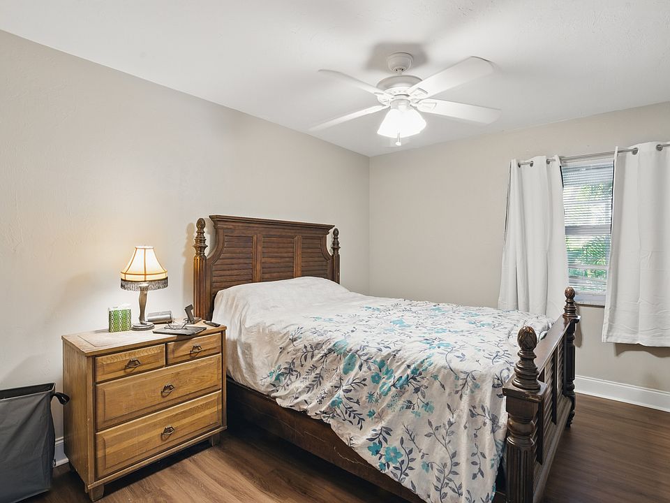 The master bedroom features spacious dimensions, luxury vinyl plank flooring, and ample natural light