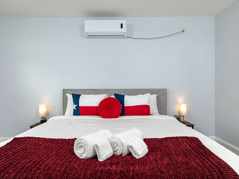 Our spacious king bed is perfectly prepped with fresh linens and rolled towels for your arrival.