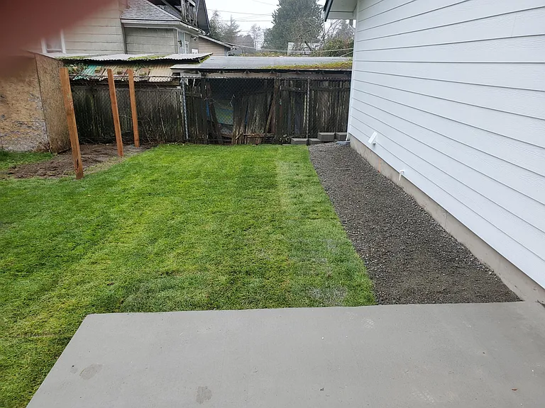 Backyard prior to 6ft fence that is now completed.