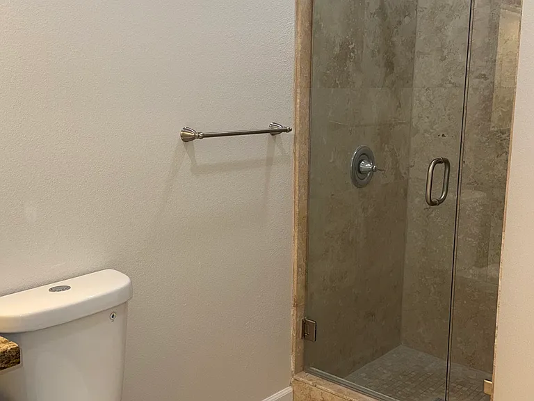 Downstairs Full Bathroom with shower connected to downstairs Bedroom