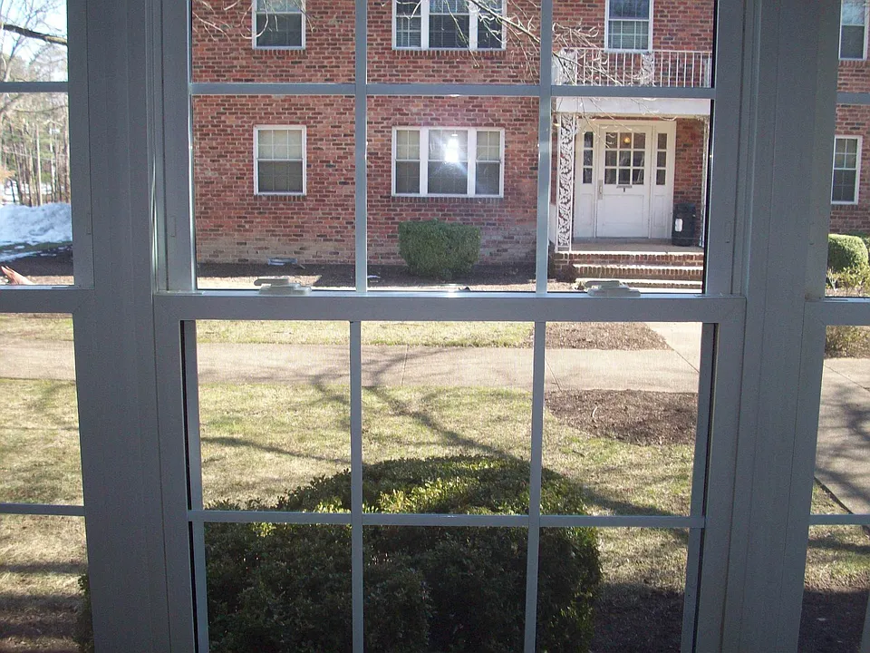 Large open bright window looking out to courtyard