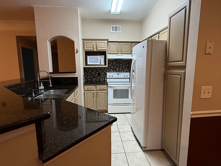 Enjoy cooking with the spacious kitchen counter.