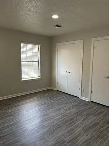 View of bedroom #2 with closet doors.