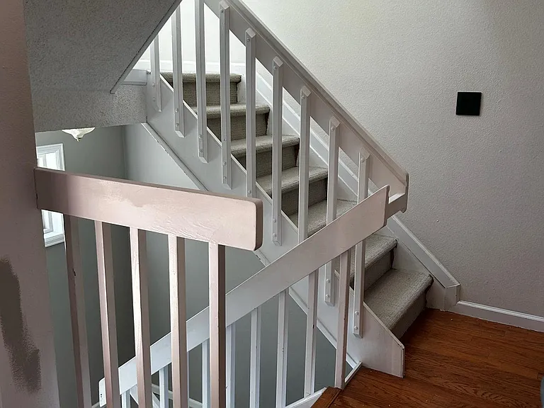 Stairs to garage (down). Stairs to second story (up)