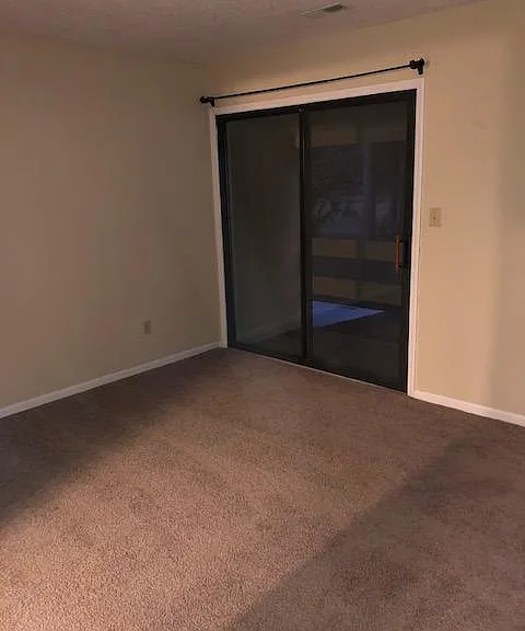 Master bedroom with balcony and en suite bathroom