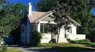 Street view of house exterior - both units have private entrances from the side/back of house, very quiet.