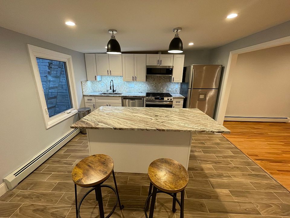 Kitchen: New cabinets, fantasy brown countertops, new gas range and microwave.