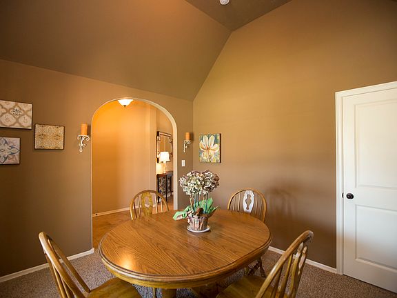 Dining Room with High Vaulted Ceiling
