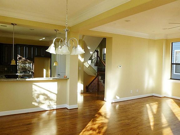 PREVIOUS BUILDOUT OF THIS FLOORPLAN great open floorplan, looking from dining room to kitchen thru to 2nd floor landing, to the right is living room