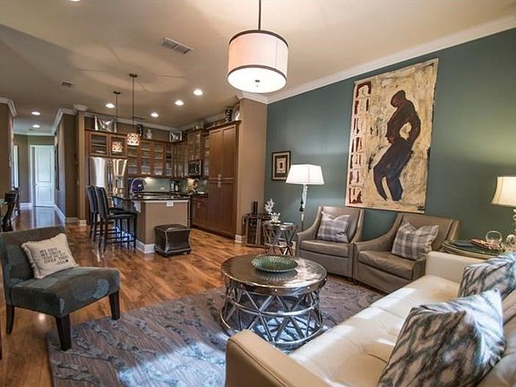 5 1/4' baseboards throughout. Crown molding downstairs.