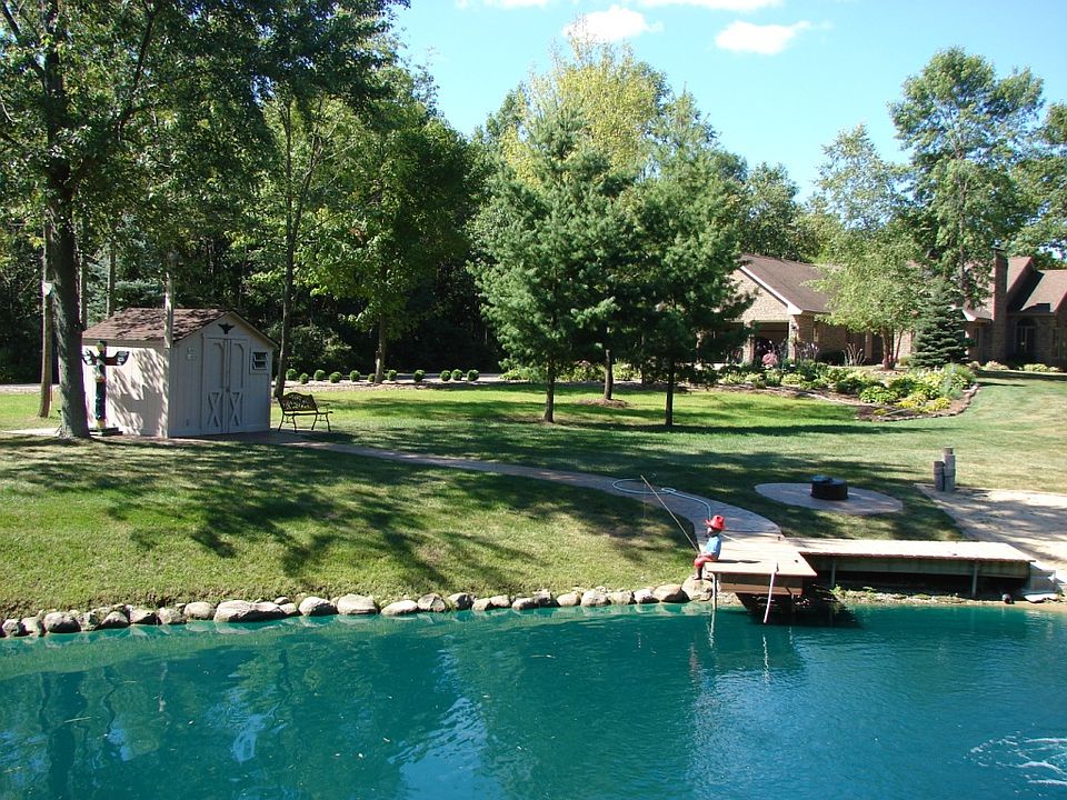 Pond with pier and shed