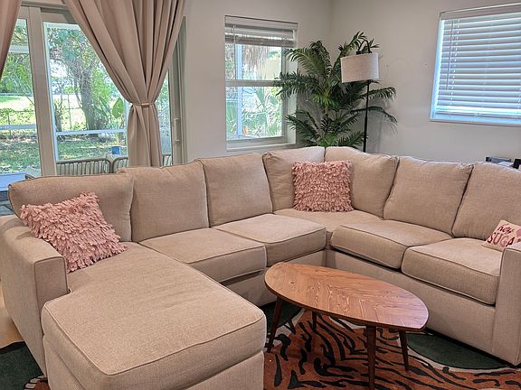 Living room, sliders to rear screened porch and private rear yard