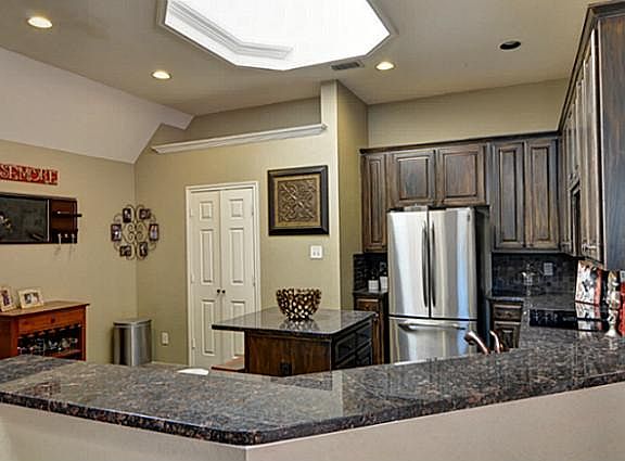 Enjoy Recessed Lighting and a Dramatic Skylight... Kitchen is Light & Bright