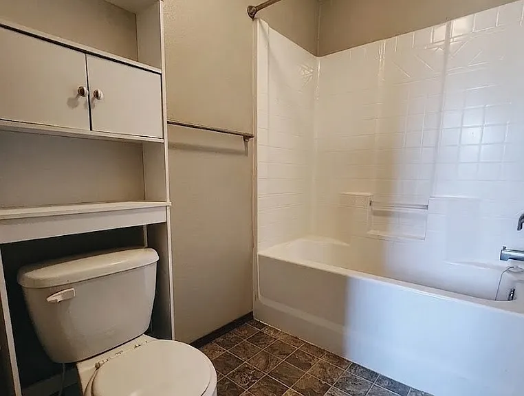 Primary bathroom with tub and shower.