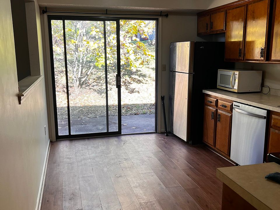 Kitchen with new stove and new dishwasher.