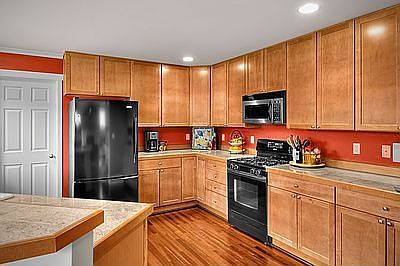 Kitchen with lots of cabinet storage space and granite counters
