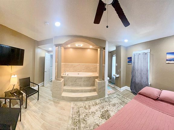 Master bedroom with jacuzzi and Smart TV