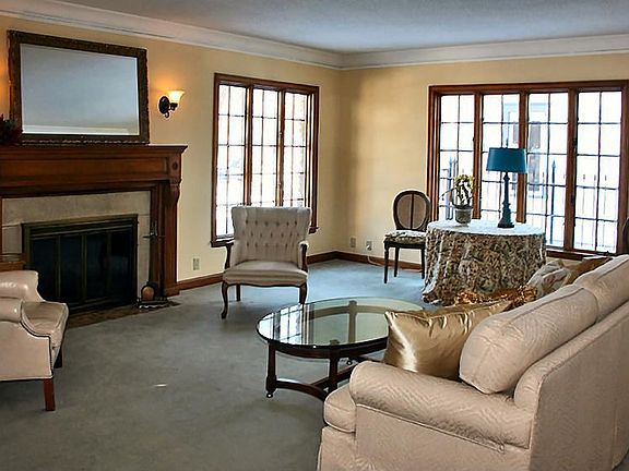 Unwind in the large light-filled living room in front of the fireplace