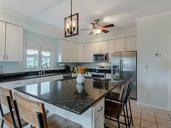 Fully stocked Kitchen. Large kitchen island with lots of seating
