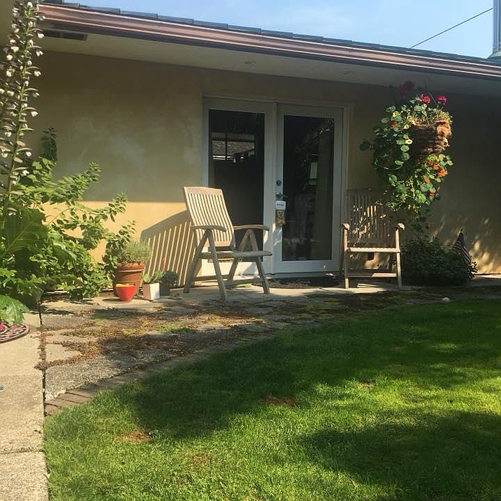 French doors open to the secret garden setting and shared patio area.