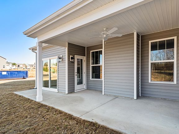 2 story, single family home with a covered front porch and spacious owner s suite