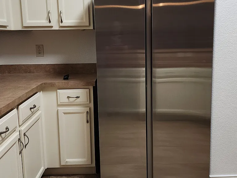 Brand new SS refrigerator in Kitchen