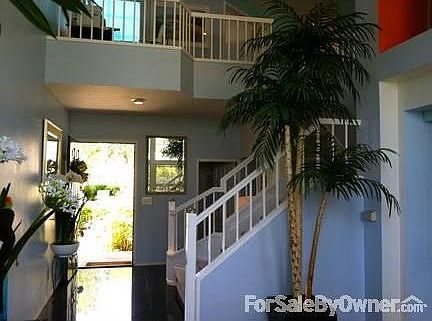 MAIN RM. VIEW OF ENTRANCE & LOFT OFFICE
