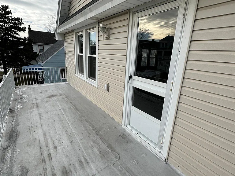 Upstairs front porch with access from living room