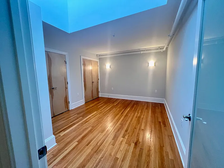 Entry to en-suite bedroom showing wall sconces.