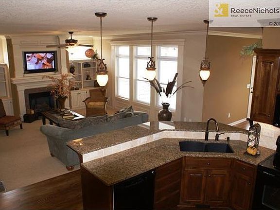 Living area is pre-wired for surround sound, security systems are installed and enjoy the fireplace with a flip of the switch.