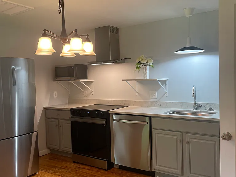 Brand new kitchen. Gleaming hardwood floors throughout!