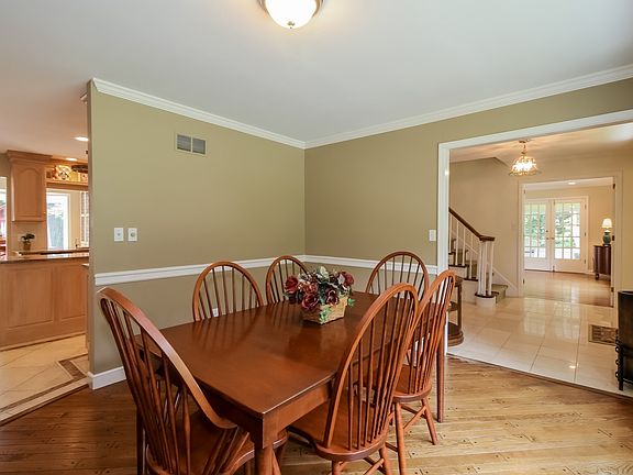 Formal dining room with horizontal pegged hardwood floors