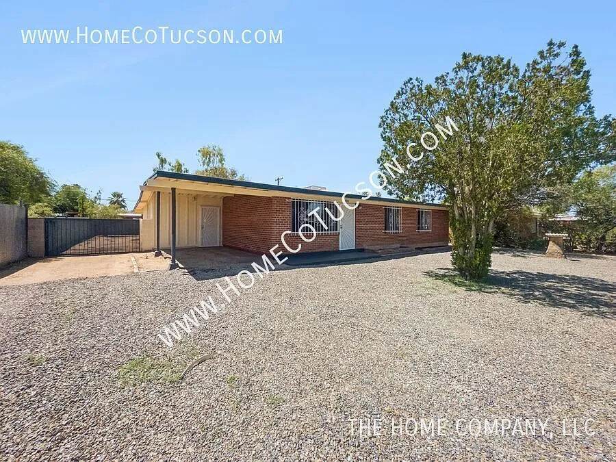 Spacious 5-Bedroom Brick Home with Large Fenced Yard | 6150 E 32nd St — Photo 2