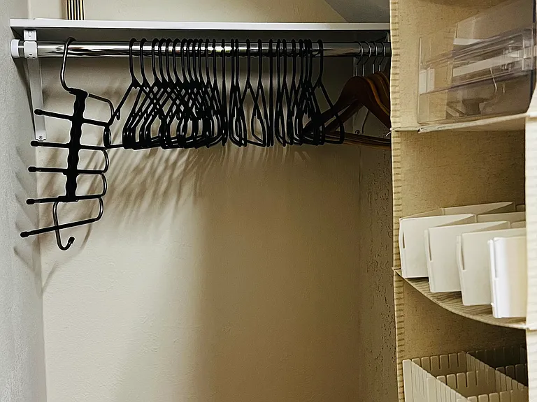Spacious walk-in closet with plenty of storage for longer stays.