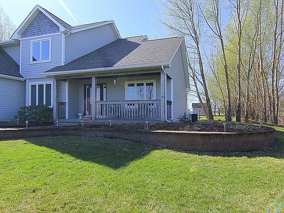 Brick Retaining Wall Around Front Perfect for Flower Beds