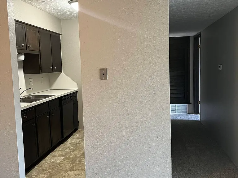 Kitchen and hallway in a unit at Whispering Isle.