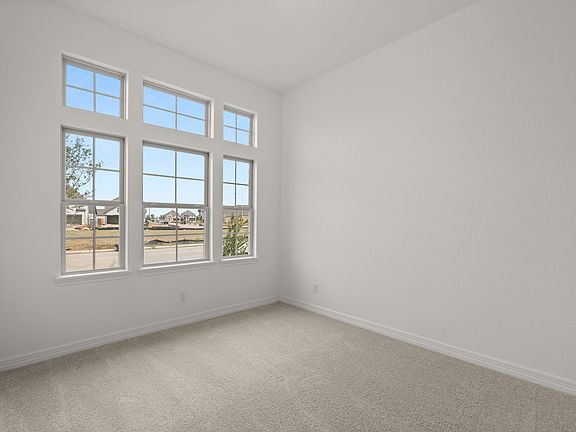 Your secondary bedroom features plush carpet, fresh paint, closet, and a large window that lets in p